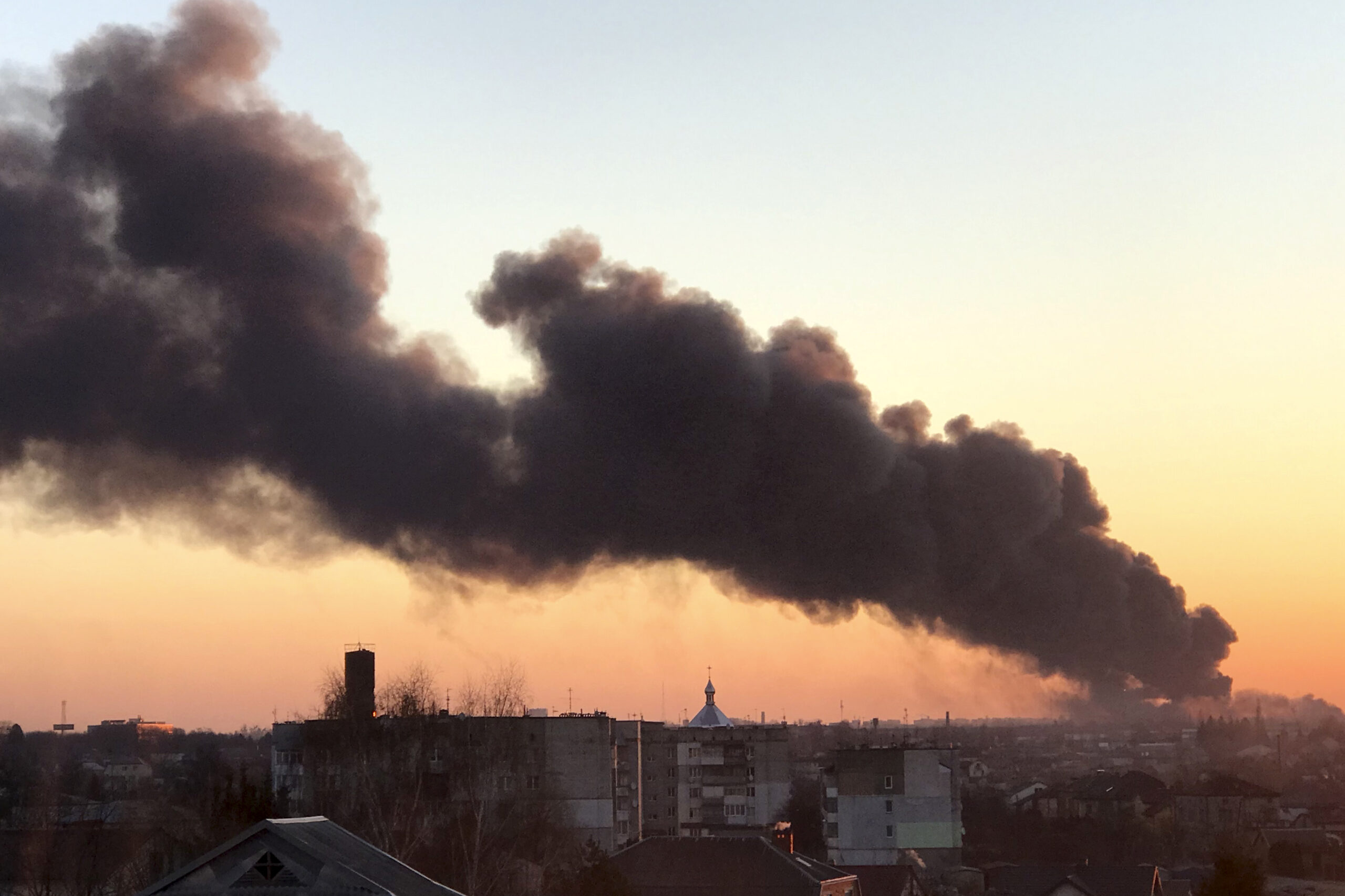 FILE - A cloud of smoke rises after an explosion in Lviv, western Ukraine, March 18, 2022. Until the missiles struck within walking distance of the cathedrals and cafes downtown, Ukraine’s cultural capital was a city that could feel distant from the war. (AP Photo, File)