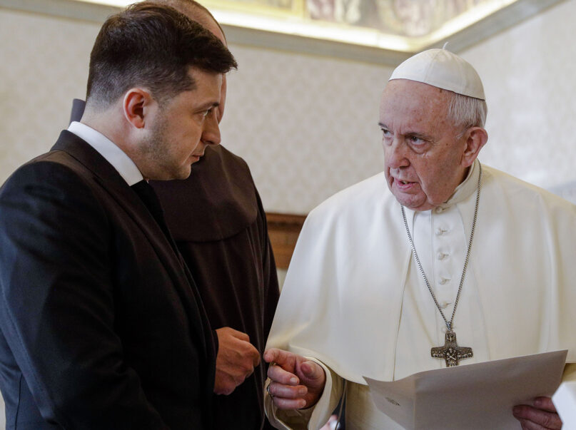 In this Feb. 8, 2020, file photo, Pope Francis exchanges gifts with Ukrainian President Volodymyr Zelenskyy, left, during a private audience at the Vatican. Zelenskyy said during a videoconference with the Italian Parliament on March 22, 2022, that he had talked with Pope Francis earlier in the morning. (AP Photo/Gregorio Borgia, Pool)