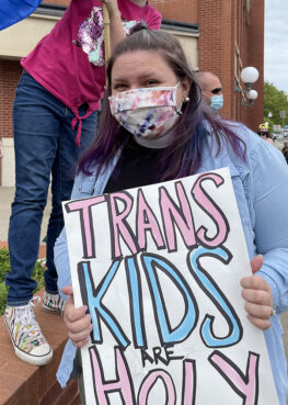 The Rev. Marianne Brown-Trigg shows support for trans kids with family and students outside Rep. Lynn Stucky’s Denton office. Photo courtesy of Marianne Brown-Trigg