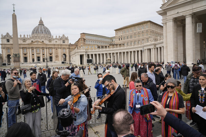 Members of the Metis community arrive in St. Peter's Square after their meeting with Pope Francis at the Vatican, Monday, March 28, 2022. (AP Photo/Gregorio Borgia)