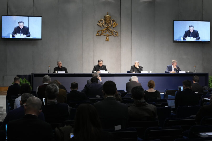 From left, Professor Gianfranco Ghirlanda, Mons. Marco Mellino, Cardinal Marcello Semeraro, and Vatican's spokesman Matteo Bruni, attend the presentation of the long-awaited reform program of the Holy See bureaucracy, during a press conference at the Vatican, Monday March 21, 2022. Pope Francis released 