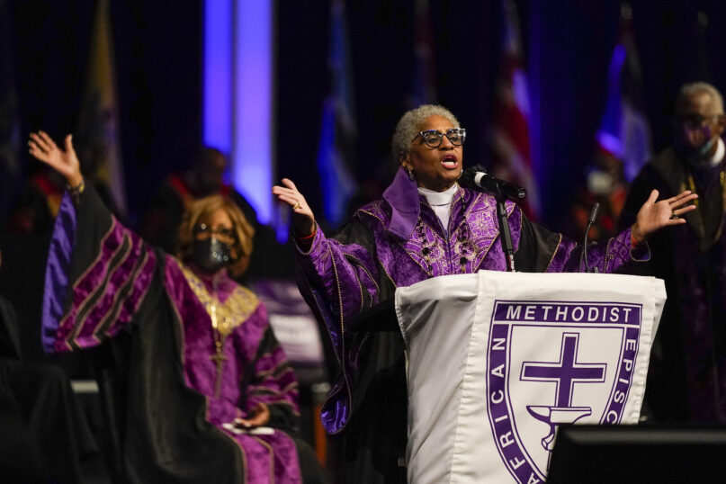 Bishop Anne Byfield, front right, President of the Council of Bishops, speaks during the opening worship service at the African Methodist Episcopal Church conference, July 6, 2021, in Orlando, Fla. Retired pastors have filed at least two federal lawsuits in recent weeks against the African Methodist Episcopal Church and several subsidiaries and financial firms the church used, claiming tens of millions of dollars from a pension fund were mismanaged and missing.(AP Photo/John Raoux, file)