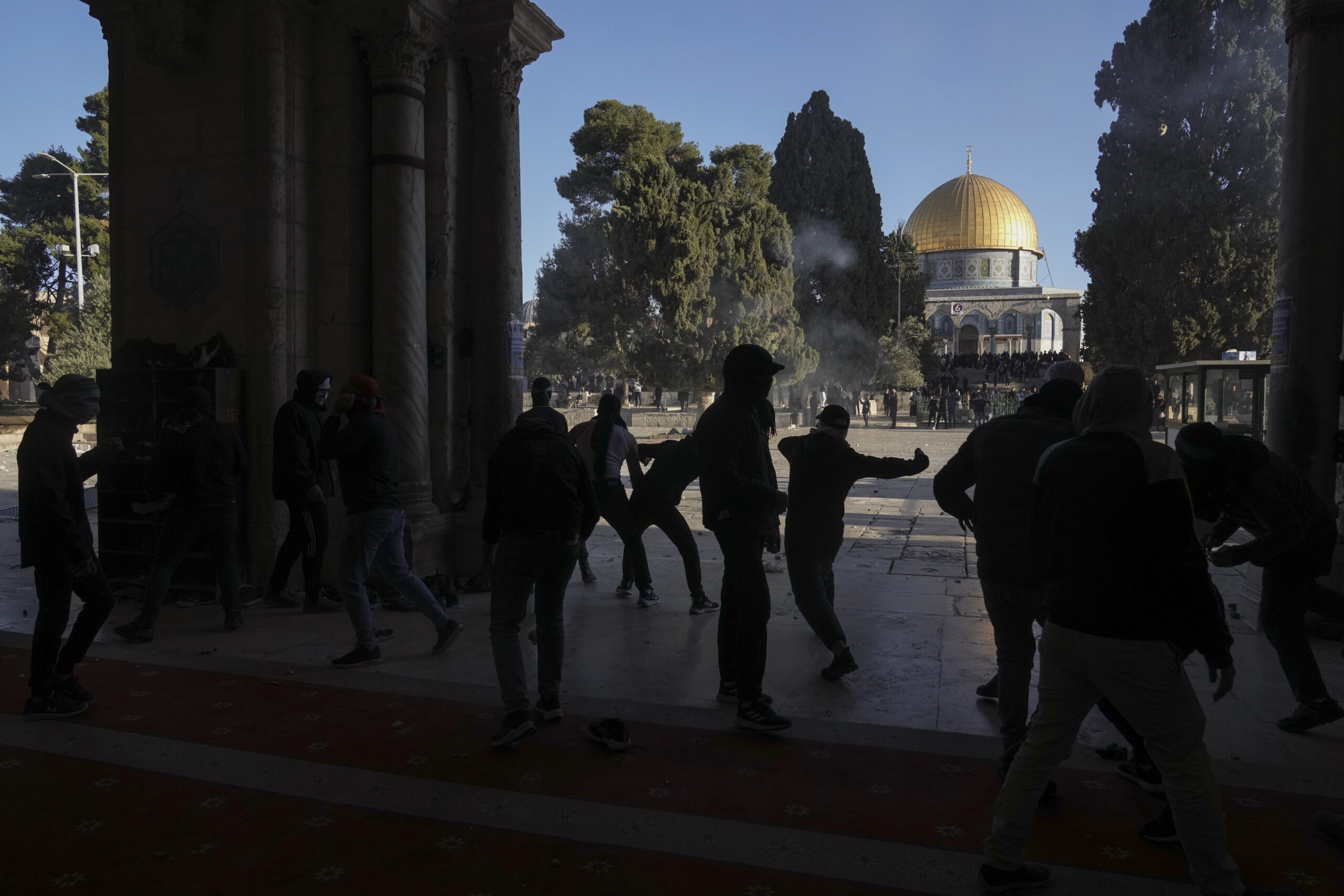 Palestinians clash with Israeli security forces at the Al Aqsa Mosque compound in Jerusalem's Old City Friday, April 15, 2022. (AP Photo/Mahmoud Illean)