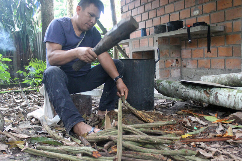 A man crushes the Banisteriopsis caapi vine, a primary ingredient for making ayahuasca, in Peru. Photo by Gary Saucedo/Archivo Centro Takiwasi/Wikipedia/Creative Commons