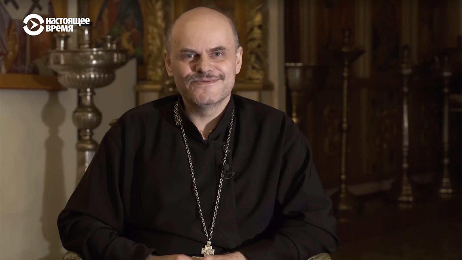 The Rev. John Burdin speaks in a recent interview in Russia. Video screen grab via CurrentTime.tv