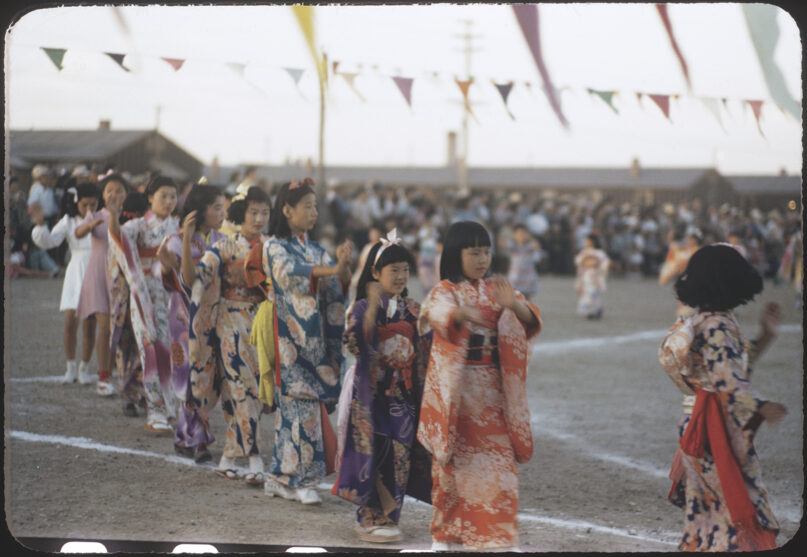 Photograph of the Obon festival at the Heart Mountain concentration camp in Wyoming during WWII. Permission to use image courtesy of Bill Manbo; Image courtesy of Eric Muller, the Bill Manbo Collection