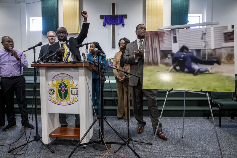 Civil rights attorney Ben Crump raises his fist while speaking during a press conference at the Renaissance Church of God in Christ Family Life Center in Grand Rapids, Michigan, on Thursday, April 14, 2022. Crump is representing the family of Patrick Lyoya, who was shot and killed by a GRPD officer on April 4. (Cory Morse/The Grand Rapids Press)