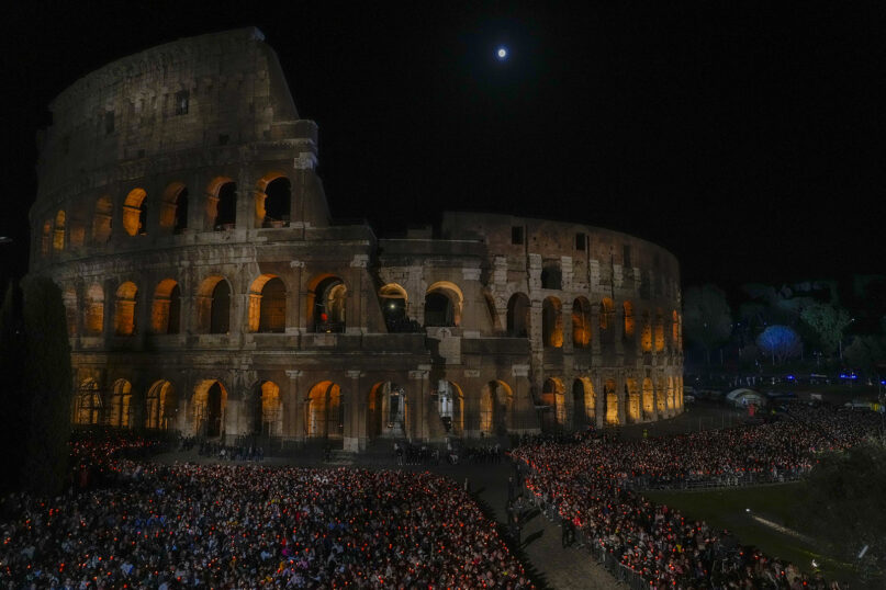 A view of the Colosseum as Pope Francis presides over the Via Crucis (Way of the Cross) torchlit procession on Good Friday, in Rome, Friday, April 15, 2022. (AP Photo/Gregorio Borgia)