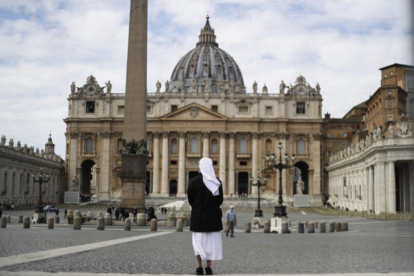 In this March 21, 2021, file photo, a nun stands in St. Peter’s Square at the Vatican. (AP Photo/Gregorio Borgia, File)