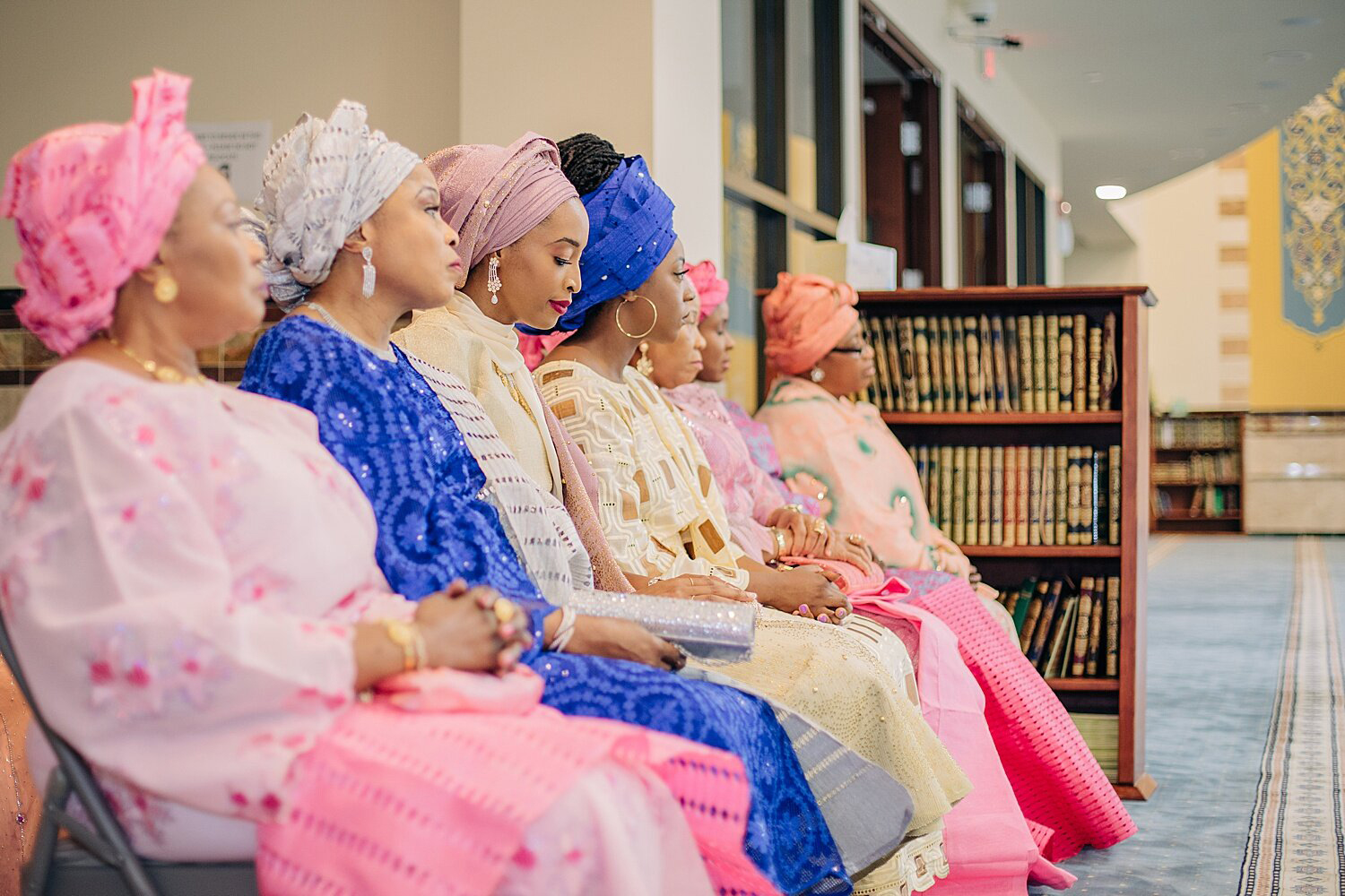 A bride and women sit together during a 2019 Muslim Nikkah, or wedding, at the Mecca Center in Willowbrook, Illinois. Photo by Fariha Wajid Photography