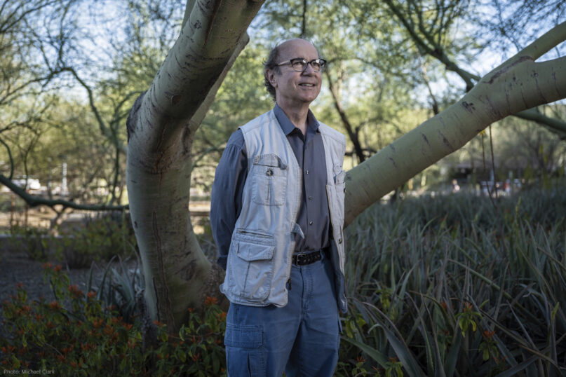 In this photo provided by the Templeton Prize, physicist Frank Wilczek stands for a portrait at Arizona State University in Tempe, Ariz., on March 17, 2022. Wilczek, the Nobel Prize-winning theoretical physicist and author renowned for his boundary-pushing investigations into the fundamental laws of nature, was honored Wednesday, May 11, 2022, with the Templeton Prize, awarded to individuals whose life’s work embodies a fusion of science and spirituality. (Michael Clark via AP)