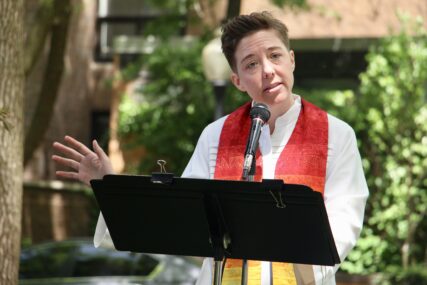 The Rev. Britt Cox preaches a sermon on Matthew 18:21-35 — and Dolly Parton's song "I Will Always Love You" on May 29, 2022, at Church of the Three Crosses in Chicago. RNS photo by Emily McFarlan Miller