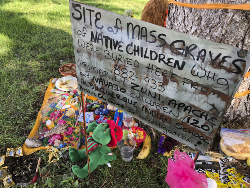 A makeshift memorial for the dozens of Indigenous children who died more than a century ago while attending a boarding school that was once located nearby is displayed under a tree at a public park in Albuquerque, New Mexico, on July 1, 2021. The U.S. Interior Department released a report May 11, 2022, about the federal government's past oversight of Native American boarding schools. (AP Photo/Susan Montoya Bryan, File)