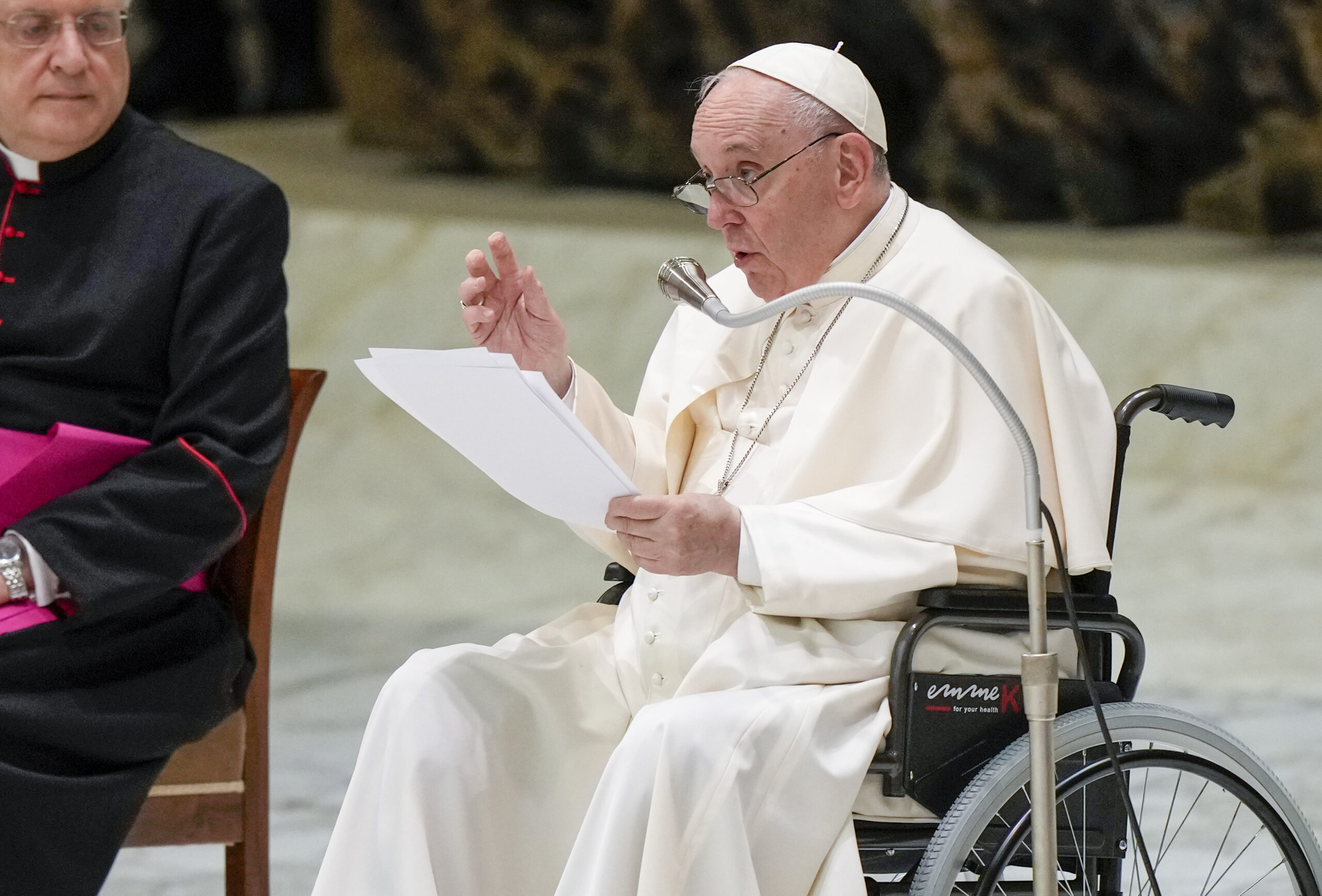 Pope Francis in a wheelchair delivers his address during an audience with members of the Italian Civil Aviation Authority in the Paul VI Hall at the Vatican, May 13, 2022. Francis suffers from strained ligaments in his right knee. (AP Photo/Andrew Medichini)