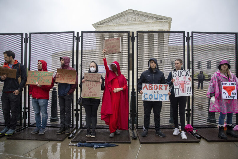 Abortion-rights protesters hold signs during a demonstration outside of the U.S. Supreme Court, May 7, 2022, in Washington. (AP Photo/Amanda Andrade-Rhoades)