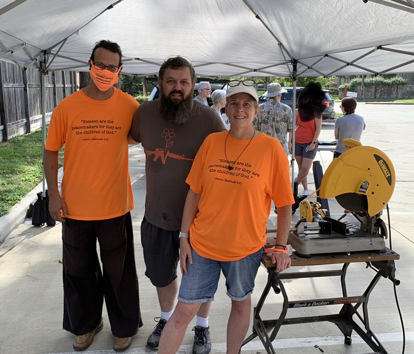 Shane Claiborne, from left, Mike Martin and the Rev. Deanna Hollas at a Guns to Gardens event at Houston Mennonite Church in Sept. 2021 in Houston. The event was scheduled for when the National Rifle Association intended to host an annual meeting in Houston. Photo courtesy Deanna Hollas
