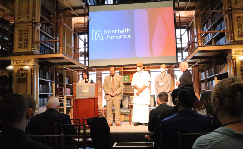 Officiants of Christian, Jewish, Muslim, Dharmic and Buddhist faiths offer blessings during an Interfaith America launch event at Georgetown Univesity on Tuesday, May 10, 2022, in Washington. RNS photo by Adelle M. Banks