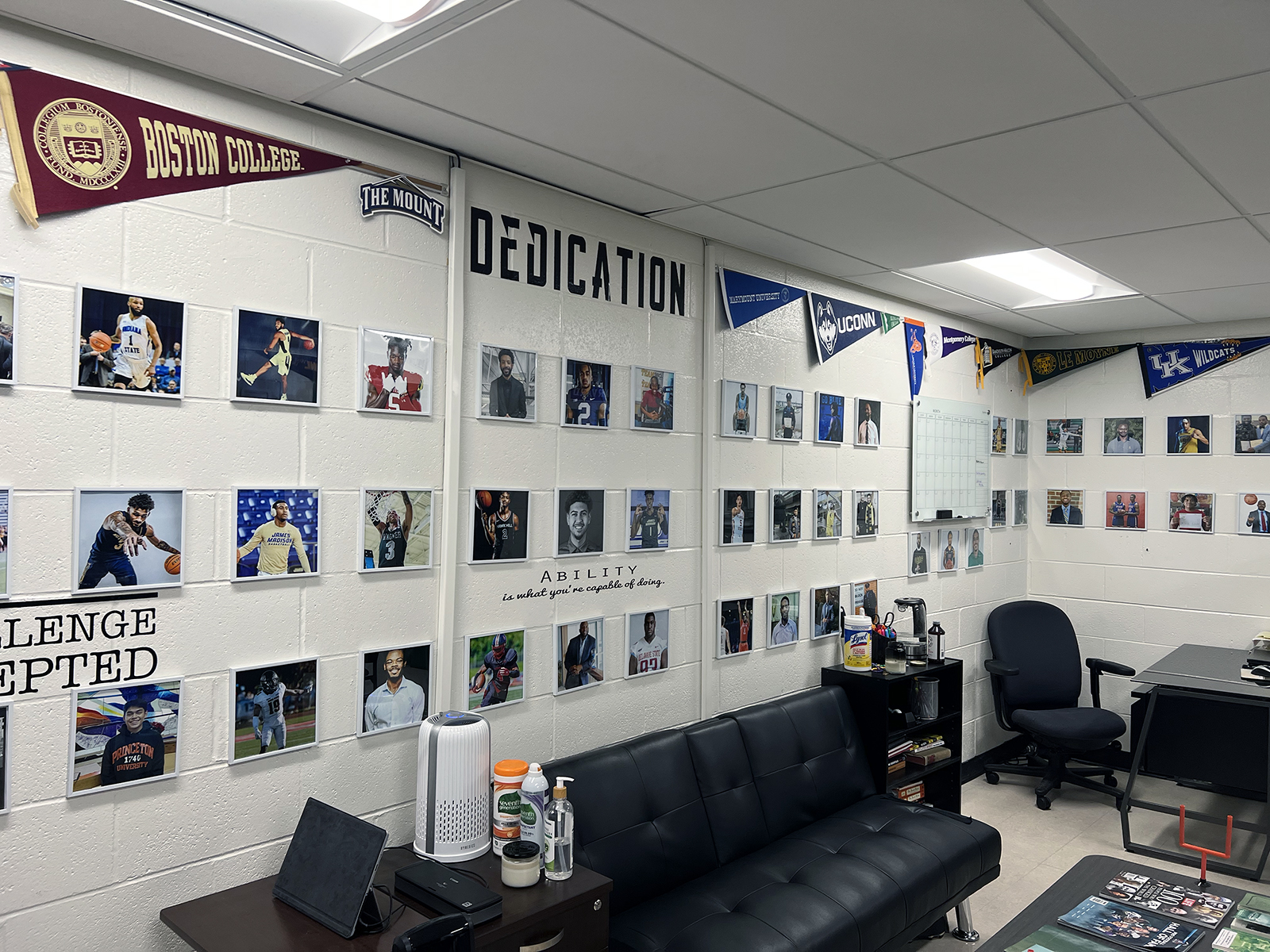 Photos of Washington Jesuit Academy alumni and banners of colleges they attended or are attending adorn the Office of Student and Alumni Success at Washington Jesuit Academy. RNS photo by Kathryn Post