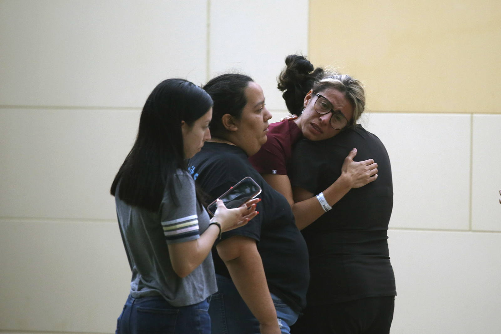 People react outside the Civic Center following a deadly school shooting at Robb Elementary School in Uvalde, Texas Tuesday, May 24, 2022. (AP Photo/Dario Lopez-Mills)