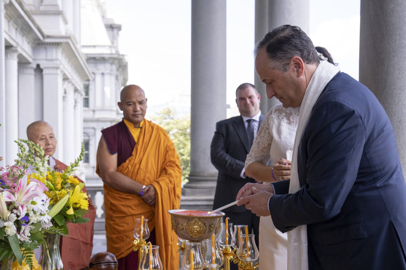 Second Gentleman Douglas Emhoff lights a candle at the White House Vesak Ceremony, May 15, 2022, in Washington. Photo courtesy The International Buddhist Association of America