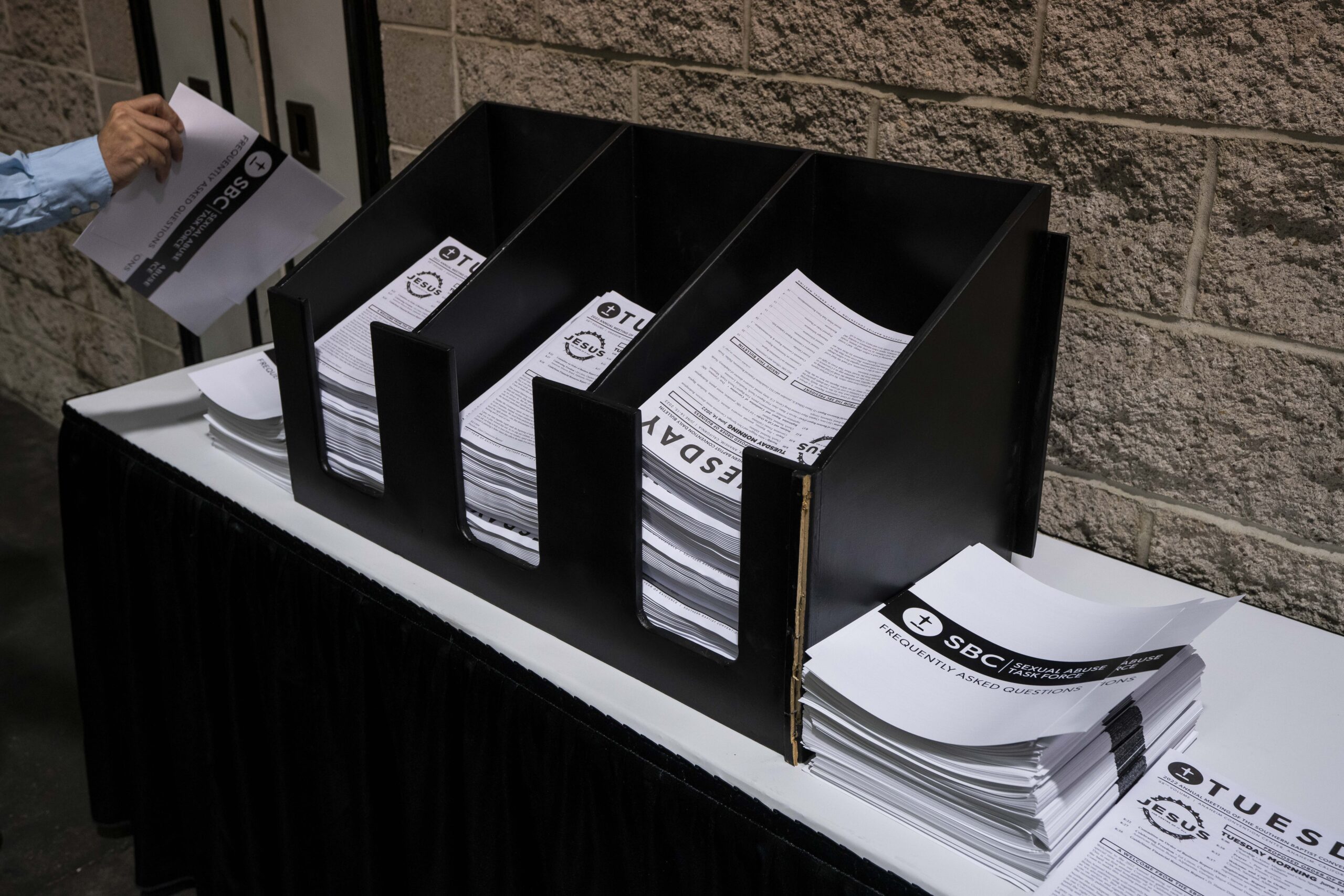 Sexual Abuse Taskforce FAQ sheets sit next to the daily bulletin during the Southern Baptist Convention held at the Anaheim Convention Center in Anaheim, California, on Tuesday, June 14, 2022. Photo by Justin L. Stewart/Religion News Service