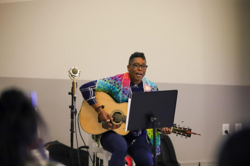 Rabbi Sandra Lawson sings and plays the guitar during the June 17 Shabbat service celebrating Juneteenth at the Distillery of Modern Art outside Atlanta. Photo courtesy of Dedra Walker/EmoryRose Photography
