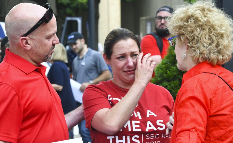 A woman describes being abused sexually by a Southern Baptist minister, outside the Southern Baptist Convention's annual meeting in June 2019, in Birmingham, Ala.  (AP Photo/Julie Bennett)