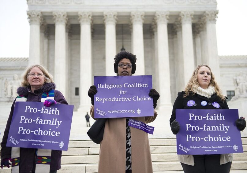 Demonstrators stand outside the Supreme Court in 2014. (Saul Loeb/AFP via Getty Images)