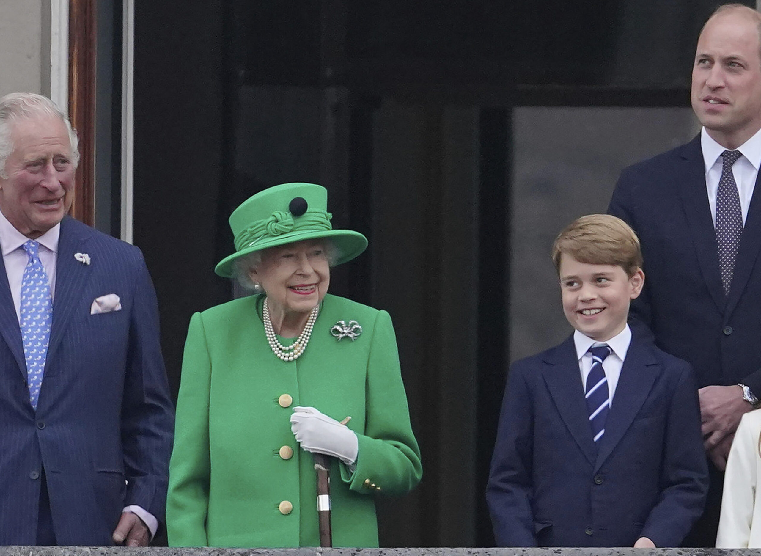 From left, Prince Charles, Queen Elizabeth II, Prince George and Prince William appear on the balcony of Buckingham Palace during the Platinum Jubilee Pageant outside Buckingham Palace in London, June 5, 2022. (Jonathan Brady/Pool Photo via AP)