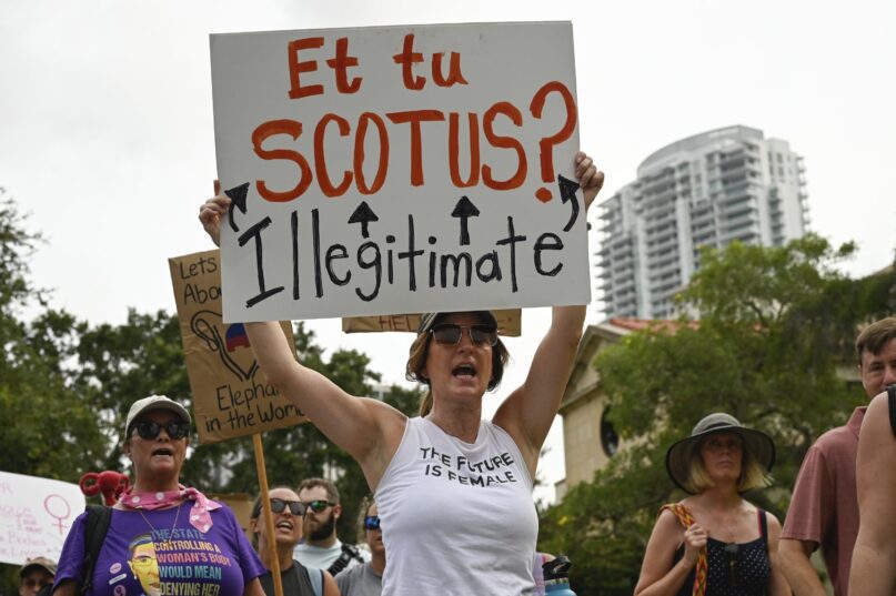 Protesters march and chant after the U.S. Supreme Court's Dobbs decision on Friday, June 24, 2022, at North Straub Park in St. Petersburg, Fla. (Jefferee Woo/Tampa Bay Times via AP)