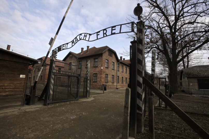 FILE - A view of the gate of the Auschwitz Nazi death camp in Oswiecim, Poland, Jan. 27, 2020.  he Auschwitz-Birkenau museum says it has been targeted with the use of “primitive” propaganda after disinformation spread on Russian social media posts. The museum said Friday, June 24, 2022 that fake posts claim to show stickers placed around the memorial site in southern Poland, an area under German occupation during World War II. The stickers say “the only gas the Russians deserve is Zykon B.