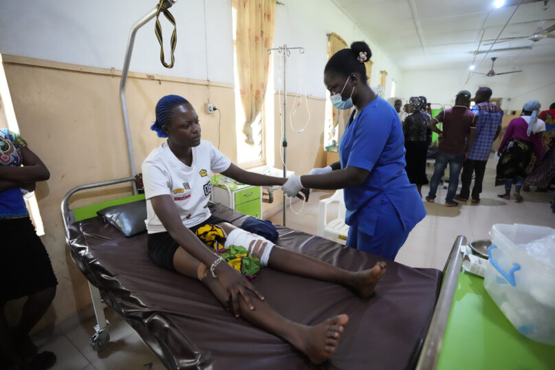 A victim of St. Francis Catholic Church attack receives treatment at St Louis Catholic Hospital in Owo, Nigeria, Monday, June 6, 2022. Lawmakers in southwestern Nigeria say more than 50 people are feared dead after gunmen opened fire and detonated explosives at a church. Ogunmolasuyi Oluwole with the Ondo State House of Assembly said the gunmen targeted the St Francis Catholic Church in Ondo state on Sunday morning just as the worshippers gathered for the weekly Mass. (AP Photo/Sunday Alamba)