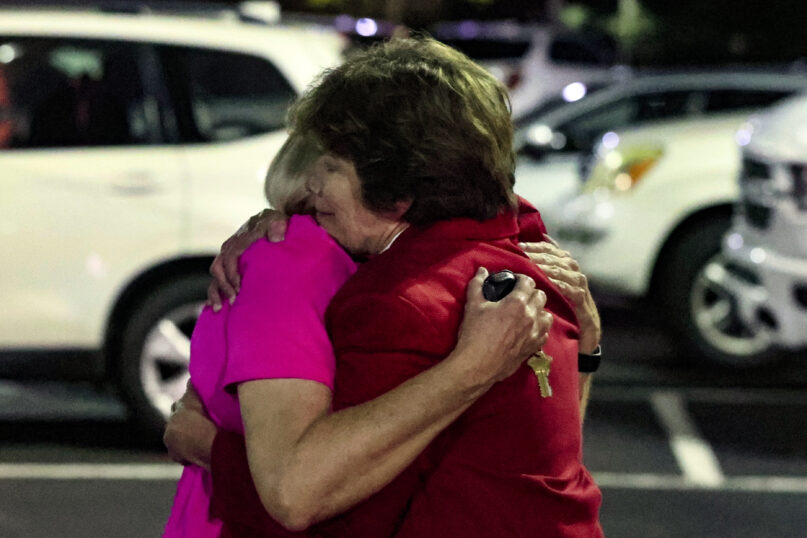 CORRECTS NAME OF CHURCH Church members console each other after a shooting at the Saint Stephen’s Episcopal Church on Thursday, June 16, 2022 in Vestavia, Ala. (AP Photo/Butch Dill)