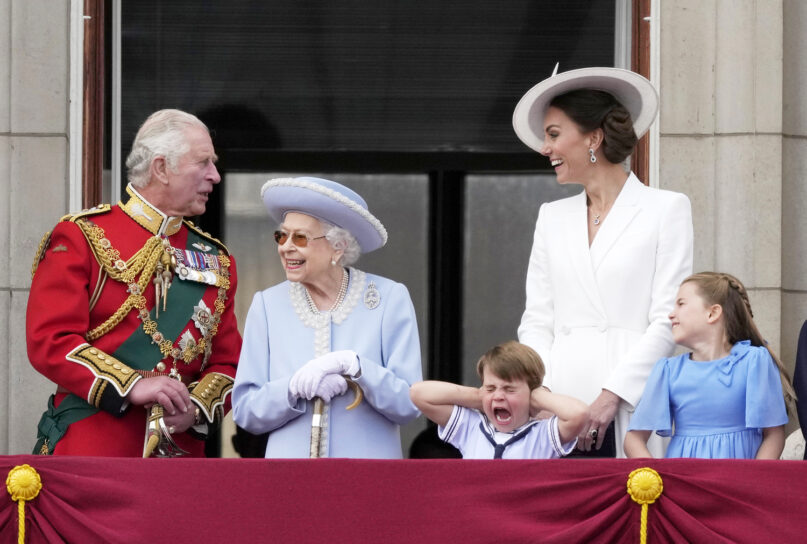 Britain's Prince Charles, left, with Queen Elizabeth II, Prince Louis her great-grandson, covering his ears with his hands, next to his mother Kate Duchess of Cambridge and Princess Charlotte her daughter, at right, stand on the balcony of Buckingham Palace, London, Thursday June 2, 2022, on the first of four days of celebrations to mark the Platinum Jubilee. The events over a long holiday weekend in the U.K. are meant to celebrate the monarch's 70 years of service. (AP Photo/Alastair Grant)
