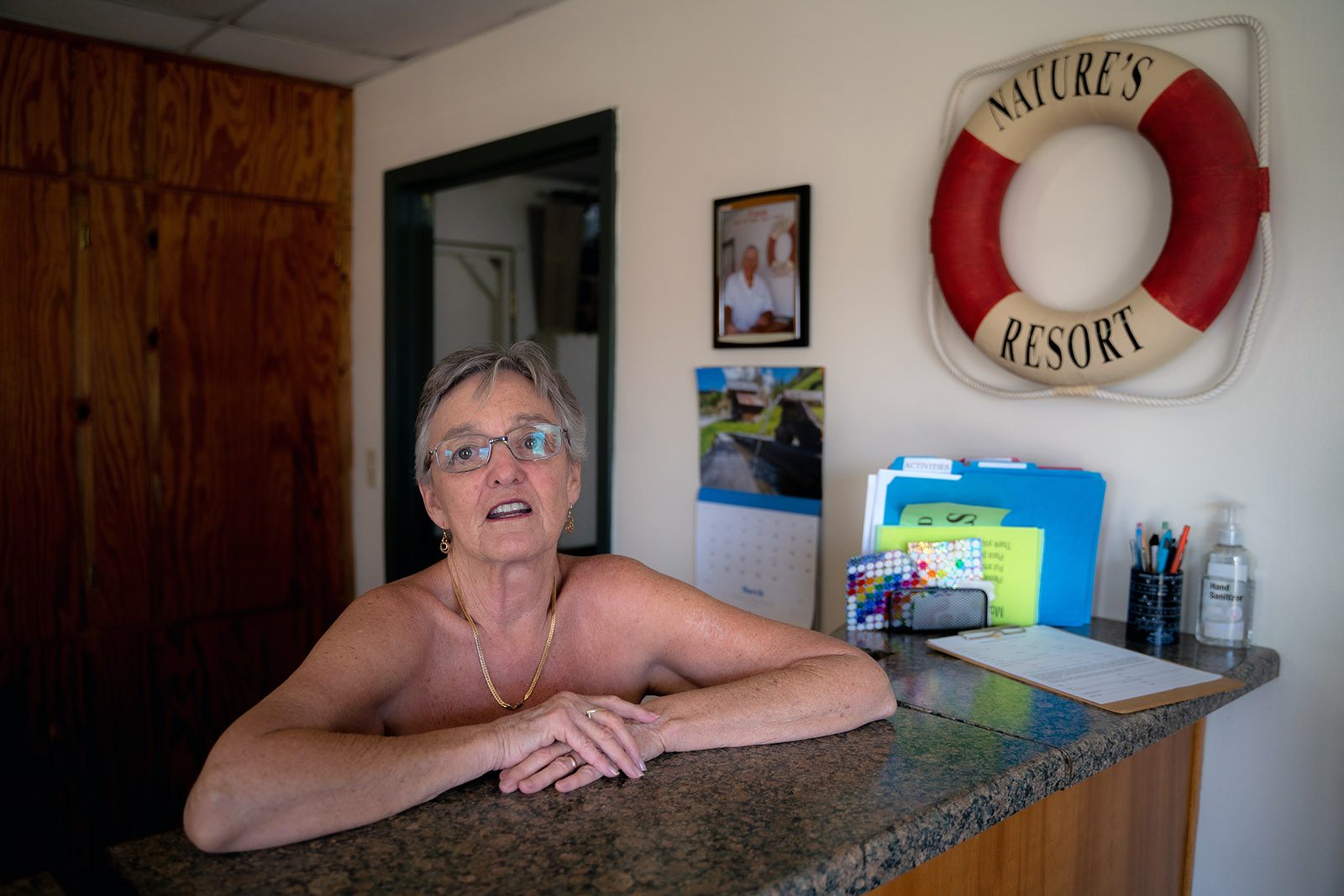 Misty Katz stands at the front desk of Nature's Resort in Elsa, Texas. Photo by Jeremy Lindenfeld