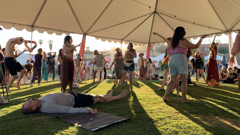 Attendees participate in a guided dancing session during DisclosureFest, June 18, 2022, at Los Angeles State Historic Park. Photo by Sam Kestenbaum