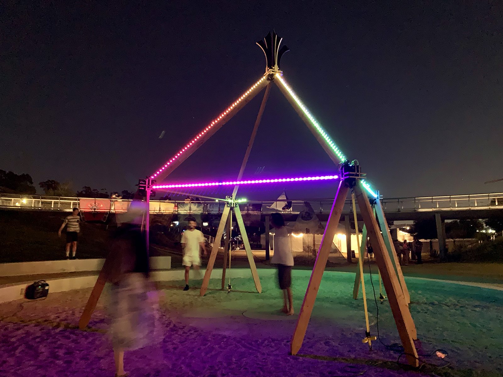 Festival goers interact with an art installation at DisclosureFest, Saturday, June 18, 2022, at the Los Angeles State Historic Park. Photo by Sam Kestenbaum