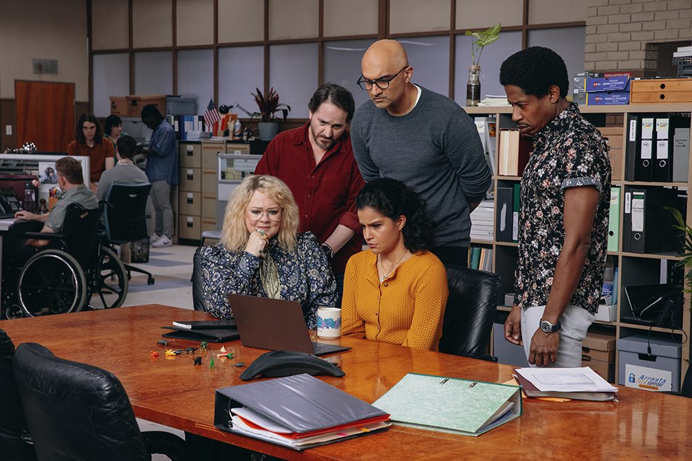 Melissa McCarthy as Amily Luck, from left, Ben Falcone as Clark Thompson, Usman Ally as Mohsin Raza, Ana Scotney as Wendy, and Chris Sandiford as Tom in "God’s Favorite Idiot." Photo by Vince Valitutti/Netflix © 2022
