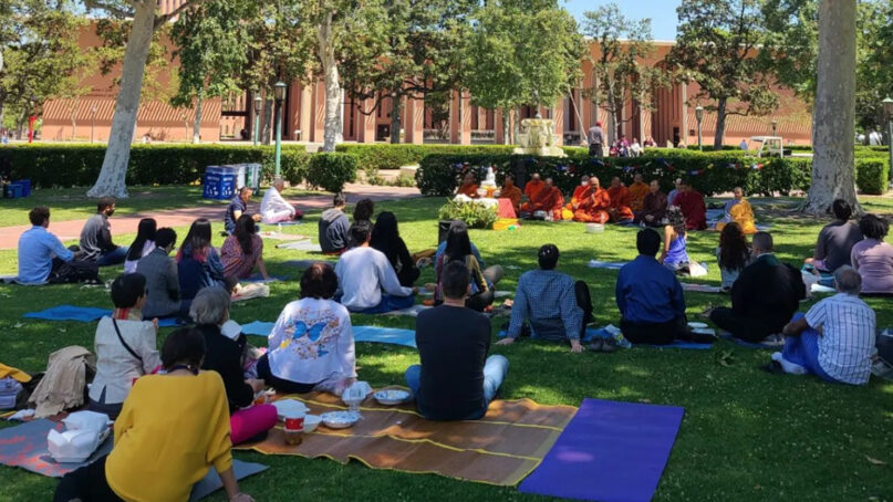 People attend a Water Festival, hosted by the USC Office of Religious and Spiritual Life, to commemorate Buddha's birthday at the University of Southern California, Wednesday, April 13, 2022, in Los Angeles. Water blessings and meditation prayers were followed by a festive water celebration by students of the USC Interfaith Council. Photo courtesy USC Office of Religious and Spiritual Life