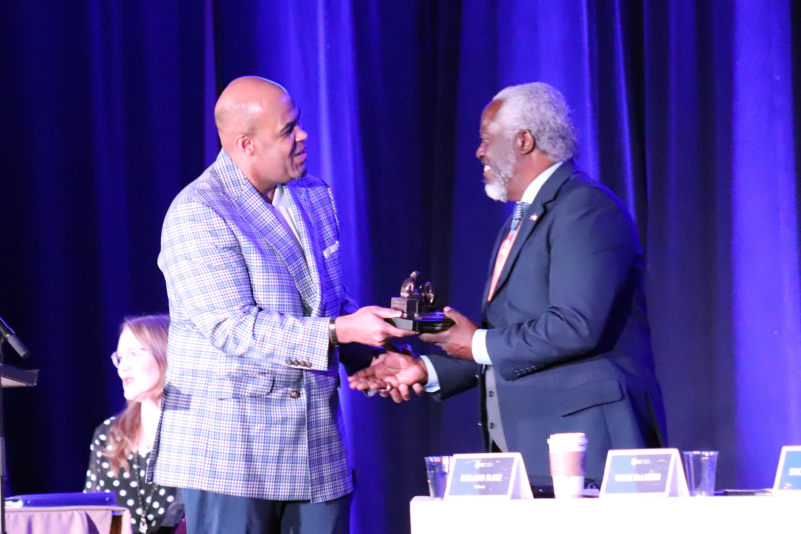 Interim Executive Committee president Willie McClaurin, left, presents a “faithful servant” award to pastor Rolland Slade, right, during an Executive Committee meeting, Monday, June 13, 2022. RNS photo by Adelle M. Banks