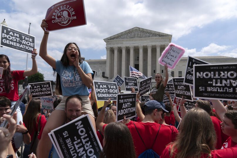 Anti-abortion protesters celebrate outside the Supreme Court in Washington, Friday, June 24, 2022. The Supreme Court has ended constitutional protections for abortion that had been in place nearly 50 years, a decision by its conservative majority to overturn the court's landmark abortion cases. (AP Photo/Jose Luis Magana)