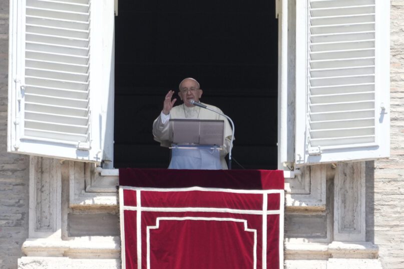 Pope Francis delivers the Angelus noon prayer from his studio window overlooking St. Peter's Square at the Vatican, Sunday, July, 10, 2022. (AP Photo/Gregorio Borgia)