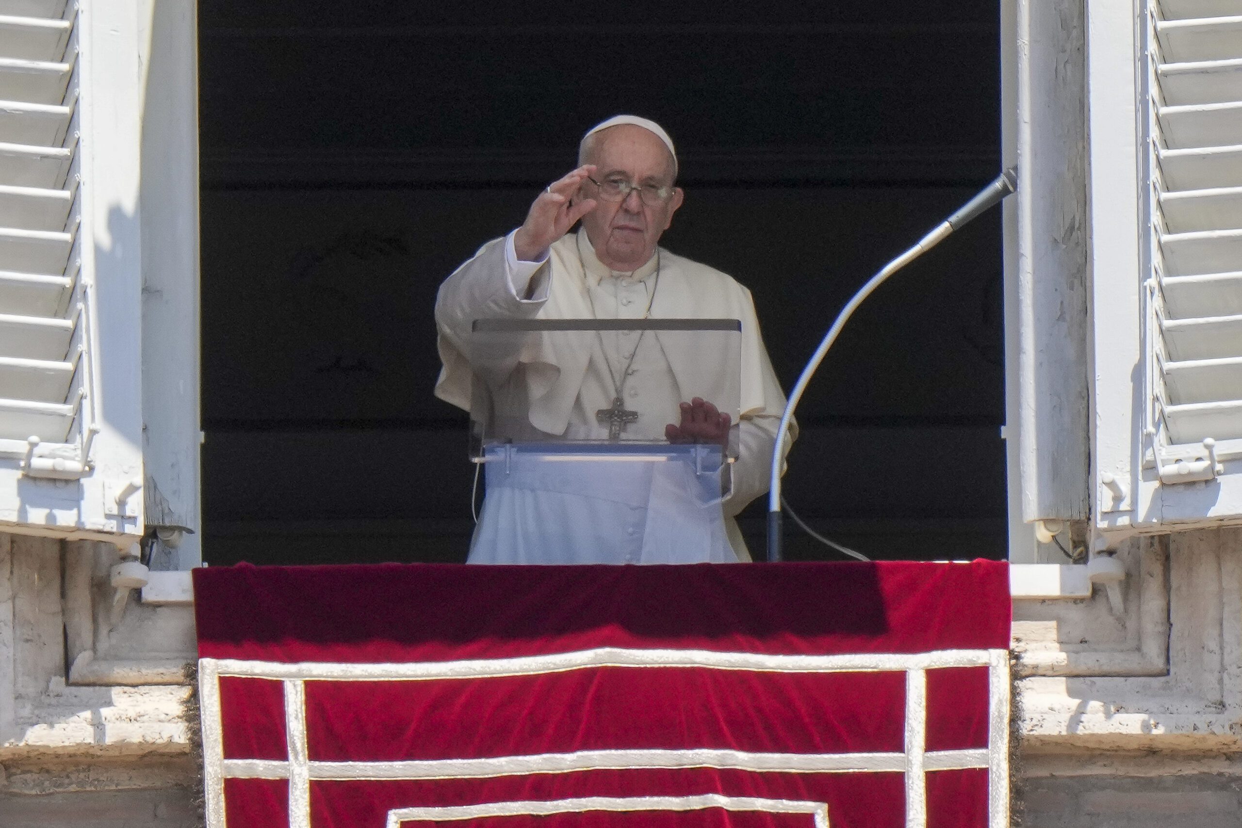 Pope Francis delivers his blessing as he recites the Angelus noon prayer from the window of his studio overlooking St.Peter's Square, at the Vatican, Sunday, July 17, 2022. (AP Photo/Andrew Medichini)