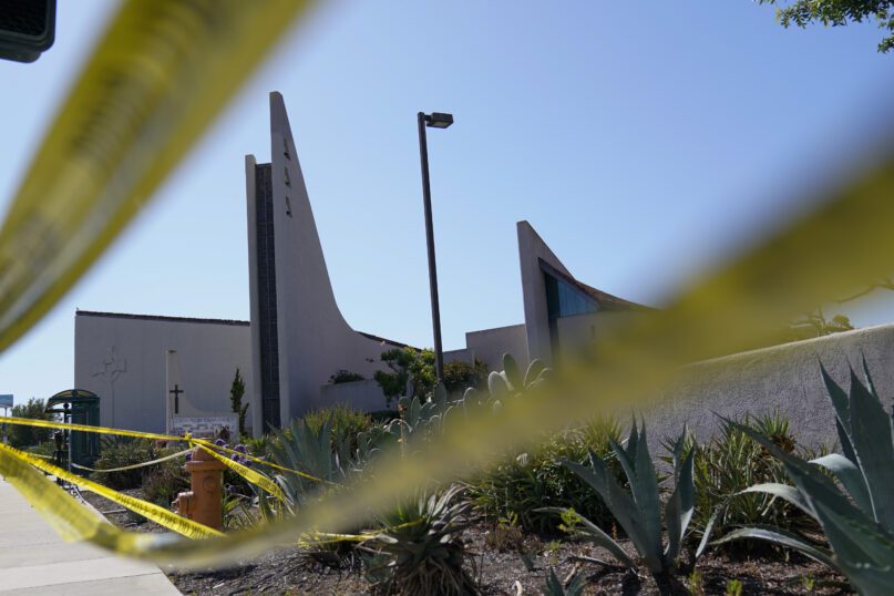 Crime scene tape surrounds Geneva Presbyterian Church on May 17, 2022, in Laguna Woods, California. A gunman opened fire on May 15 during a luncheon at the church, killing one person and injuring five other members of a Taiwanese congregation that met there. (AP Photo/Ashley Landis, File)