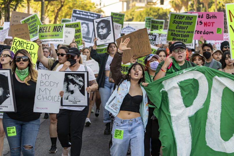 Abortion-rights activists march outside the First Street U.S. Courthouse, Central District of California, in downtown Los Angeles, Monday, June 27, 2022. (AP Photo/Damian Dovarganes)