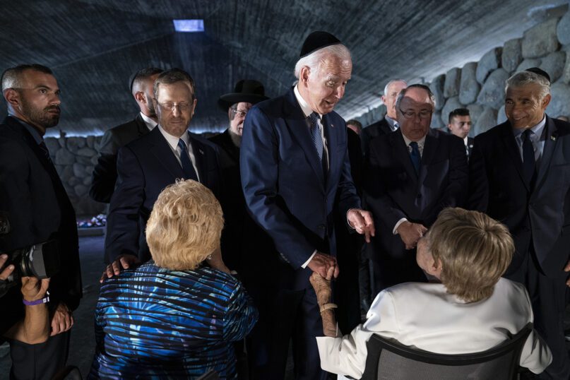 President Joe Biden talks with American Holocaust survivors Dr. Gita Cycowicz and Rena Quint in the Hall of Remembrance at Yad Vashem, July 13, 2022, in Jerusalem. (AP Photo/Evan Vucci)