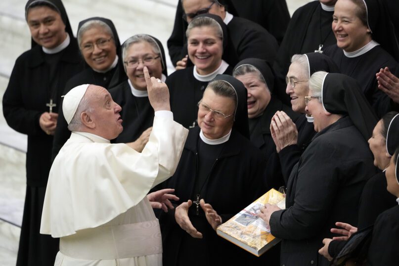 Pope Francis salutes a group of nuns at the end of his weekly general audience in the Paul VI Hall the Vatican, Nov. 24, 2021. (AP Photo/Andrew Medichini)