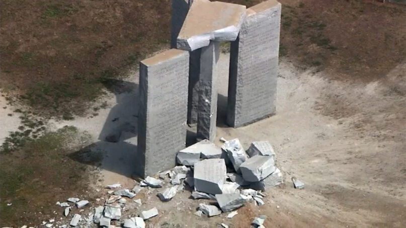 Damage to the Georgia Guidestones monument near Elberton, Georgia, on July 6, 2022. The Georgia Bureau of Investigation said the monument, which some Christians regard as satanic, was damaged by an explosion. Officials later removed the entire monument due to safety concerns. Video screen grab via WSB-TV