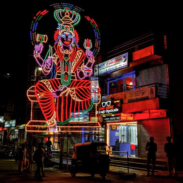 A Kali figure made of neon lights. Photo by Mubarak Sheik/Unsplash/Creative Commons