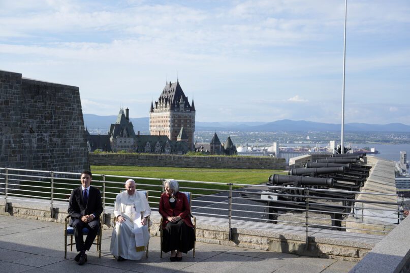 Pope Francis is flanked by Canadian Prime Minister Justin Trudeau, left, and Governor-General Mary Simon, right, at the Citadelle de Quebec, July 27, 2022. Francis is on a “penitential” visit to Canada to beg forgiveness from survivors of the country’s residential schools, where Catholic missionaries contributed to the “cultural genocide” of generations of Indigenous children by trying to stamp out their languages, cultures and traditions. (AP Photo/Gregorio Borgia)